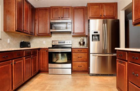 cherry cabinets with black stainless steel appliances|cherry kitchen cabinets photo gallery.